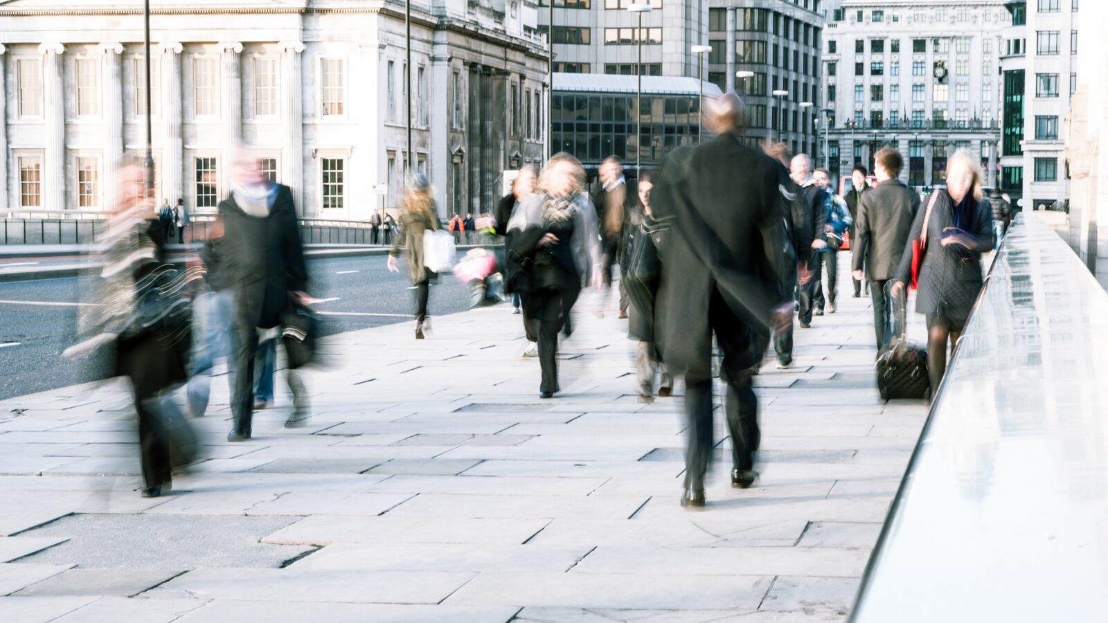 Pedestrians moving through a busy city street